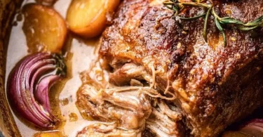 Apple Cider Braised Pork Shoulder served with seasonal vegetables