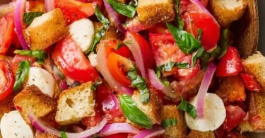 Colorful and fresh bread salad with vegetables and dressing