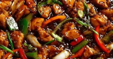 Delicious chicken in garlic sauce served on a plate.