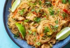 Bowl of Chicken Vermicelli Noodles garnished with fresh herbs and vegetables