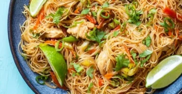 Bowl of Chicken Vermicelli Noodles garnished with fresh herbs and vegetables