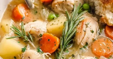 Slow cooker white wine chicken stew with vegetables and herbs