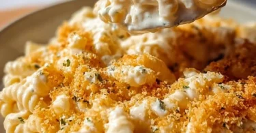 Creamy Boursin Mac and Cheese served in a bowl, garnished with herbs.