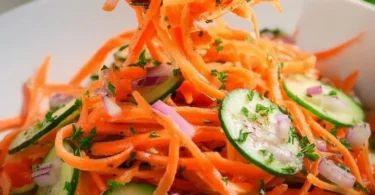 Fresh and colorful Cucumber Carrot Salad served in a bowl