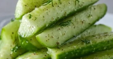 Garlic Dill Cucumbers in a jar, showcasing fresh ingredients and vibrant flavors.