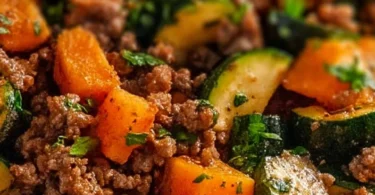 Ground beef zucchini sweet potato skillet cooked in a frying pan
