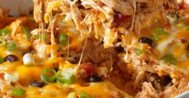 Healthy chicken taco casserole dish served in a bowl with toppings