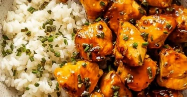 Hot honey chicken bowls with colorful vegetables and rice