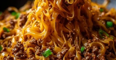 Delicious Mongolian ground beef noodles served in a bowl with vegetables