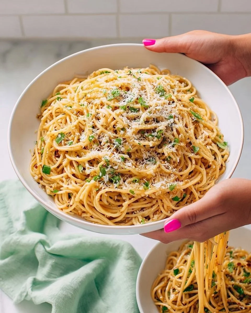 Delicious Vietnamese Garlic Noodles garnished with herbs and vegetables
