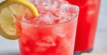 Refreshing watermelon lemonade in a glass with mint garnish